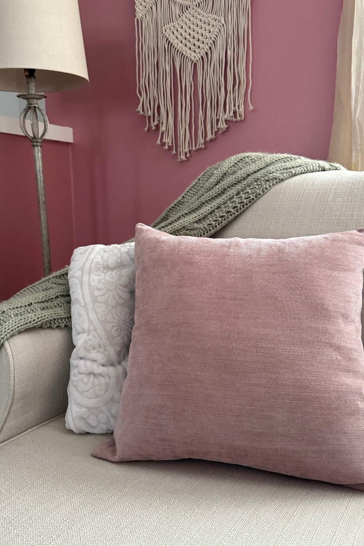 sage mauve cream living room color palette (1) Dusty rose pillow, cream and sage throw blankets in a living room reading nook.