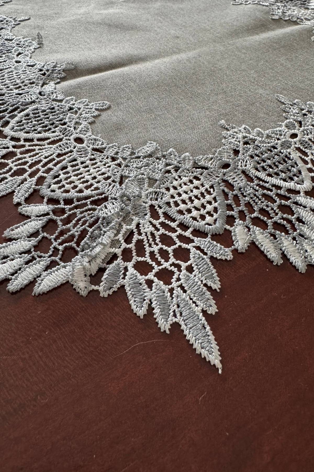 Silver lace-edged table runner.