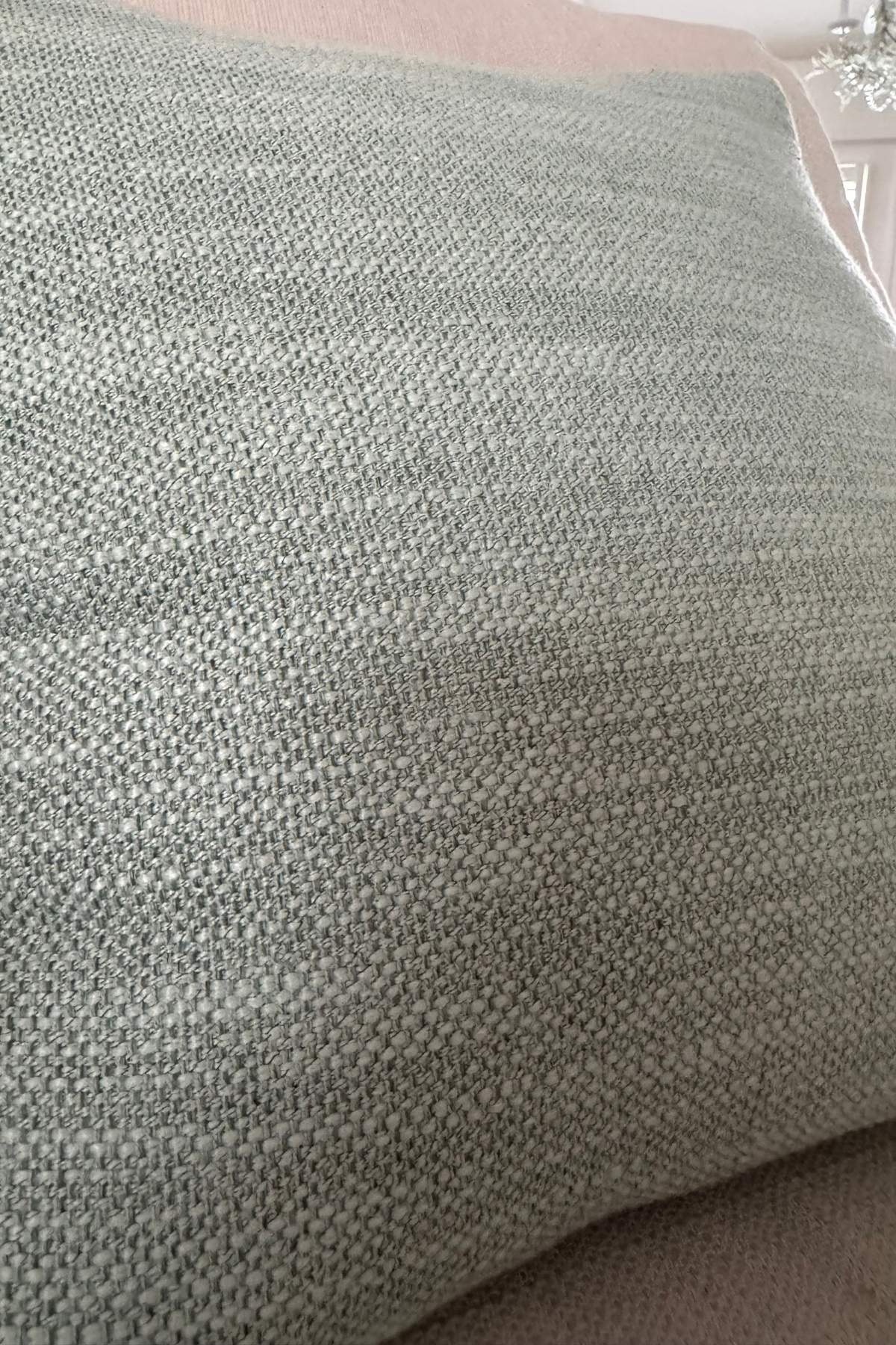 Soft sage, linen-textured throw pillow