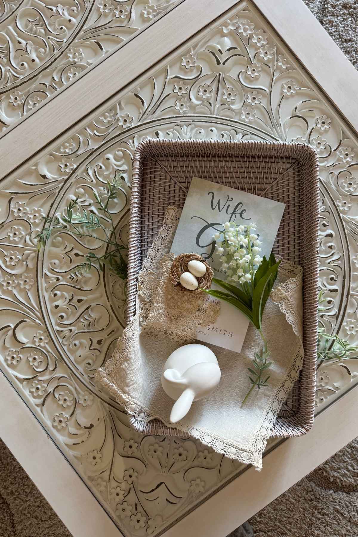 Storybook Cottage spring coffee table with flowers, eggs, and a decorative bunny