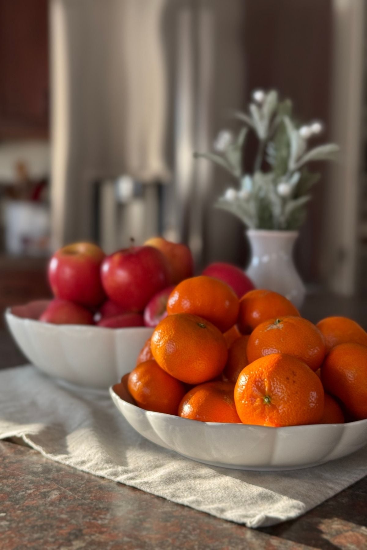 Storybook Cottage kitchen moment with fruit bowls, warm wood tones, and everyday cottage charm