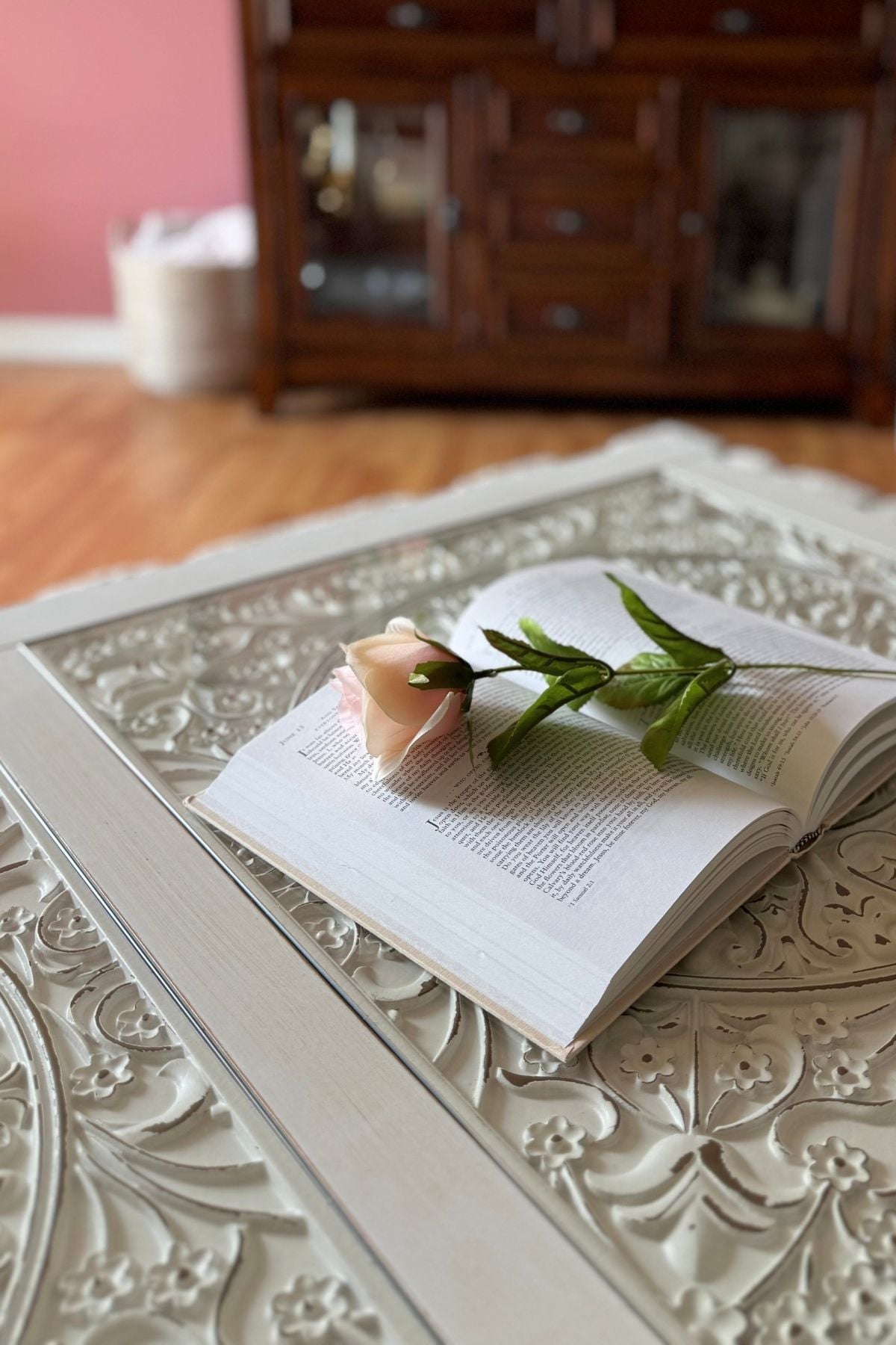 cottage style coffee table centerpiece Simple coffee table centerpiece with a book and a single rose