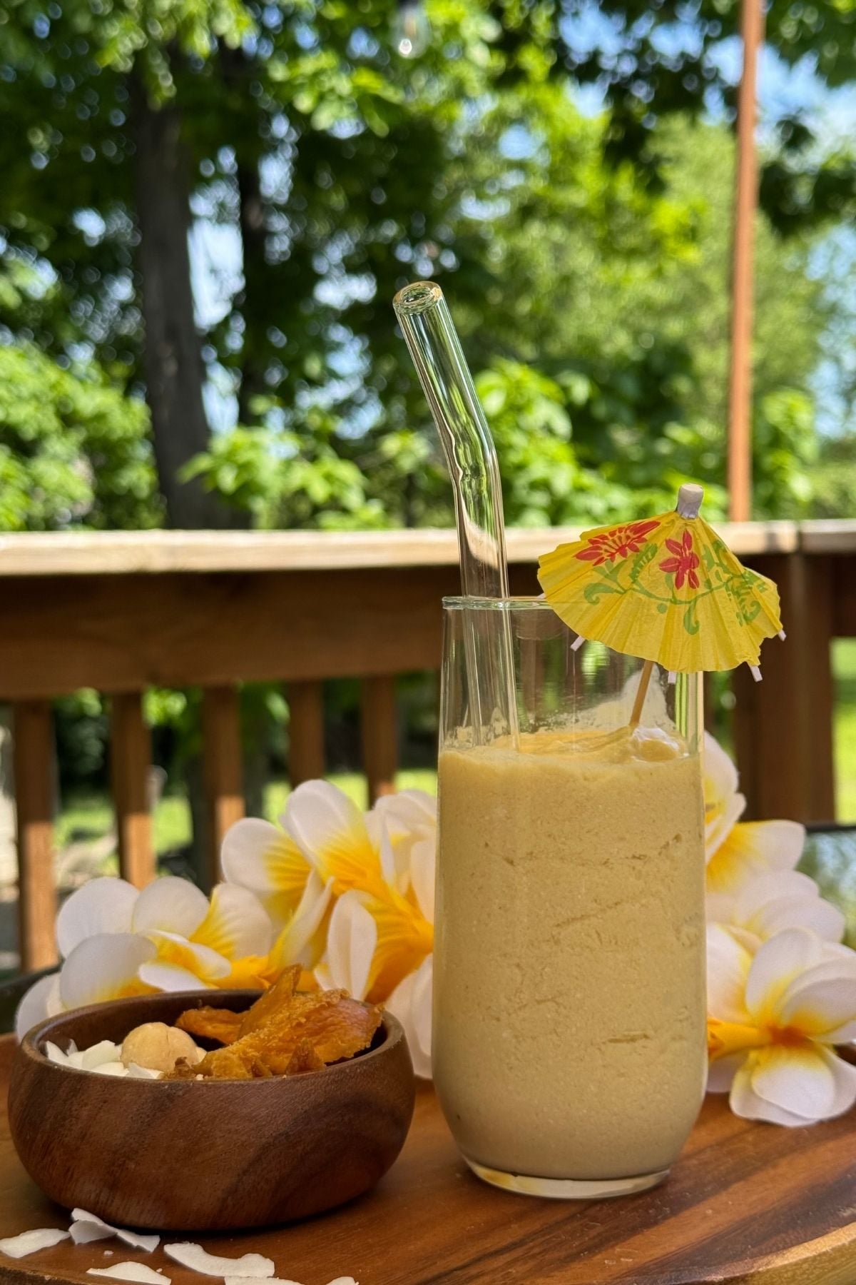 Tropical mango smoothie prepared with coconut milk and sweetened with honey.