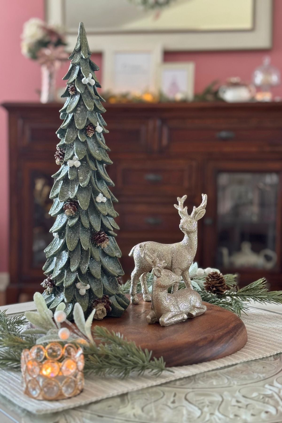 Storybook Christmas coffee table centerpiece Woodland Christmas centerpiece on the Storybook coffee table featuring an evergreen tree and champagne deer on a wood tray