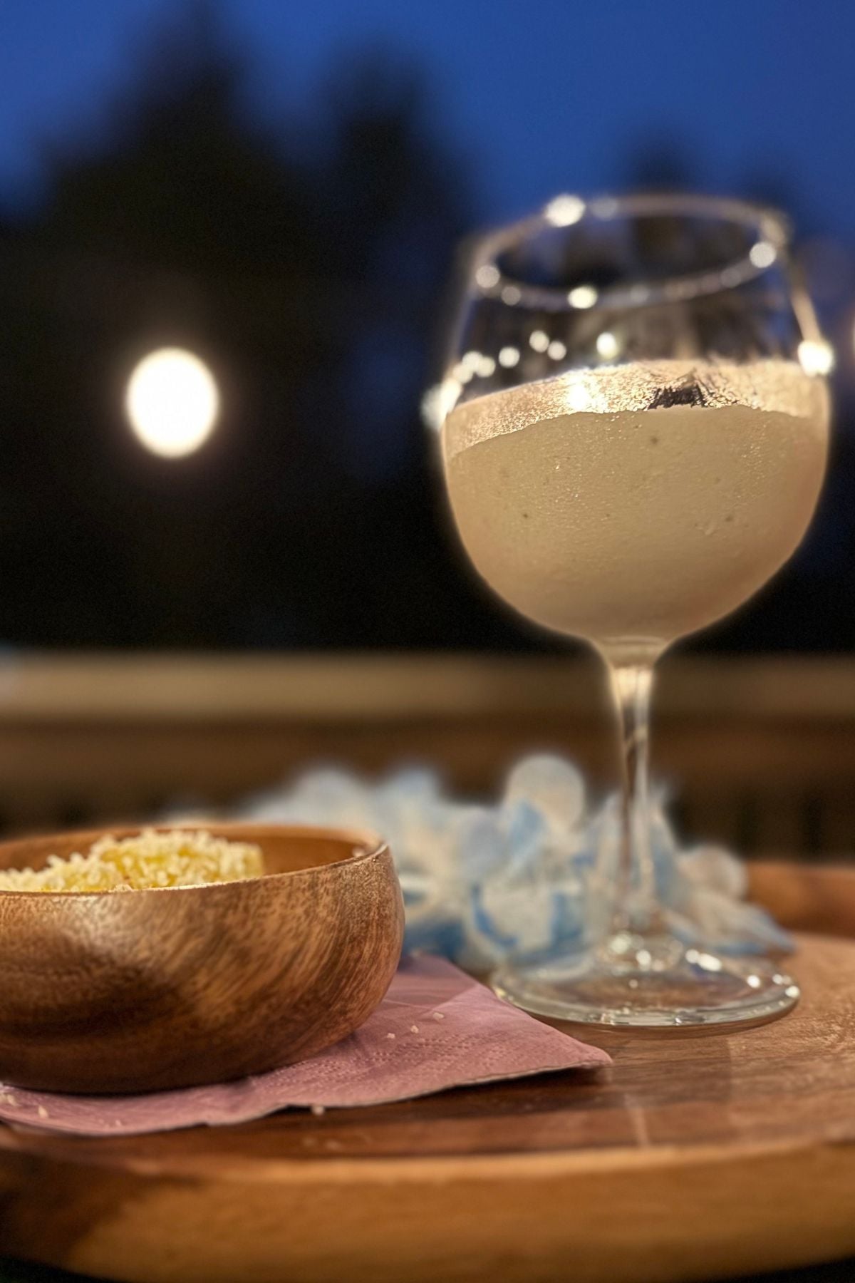 luau for one creamy macadamia colada (2) Creamy Macadamia Colada served on an acacia wood tray with pineapple bites rolled in coconut during a Luau for One.