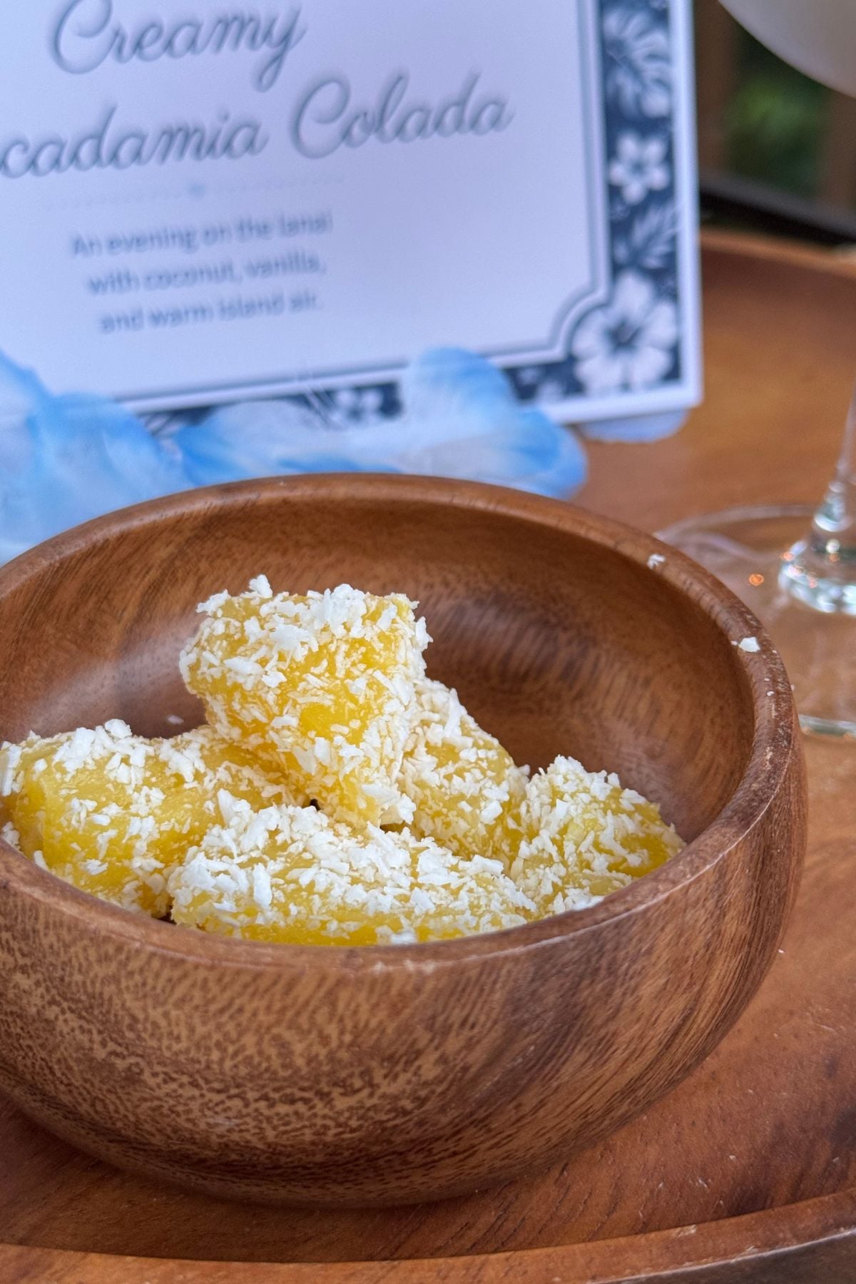 pineapple bites Pineapple bites coated in shredded coconut served as a simple tropical snack.