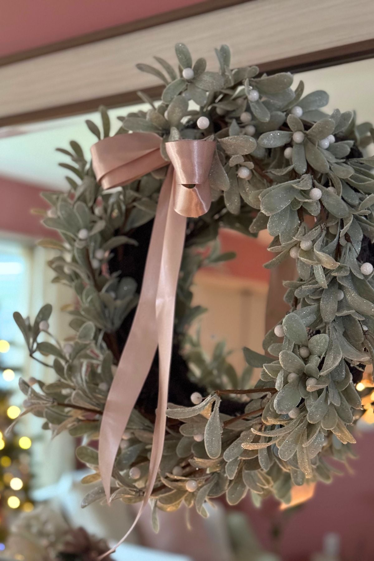 silver sage Christmas wreath with a blush satin ribbon Dusty sage Christmas wreath with pearly berries and flowing blush satin ribbon
