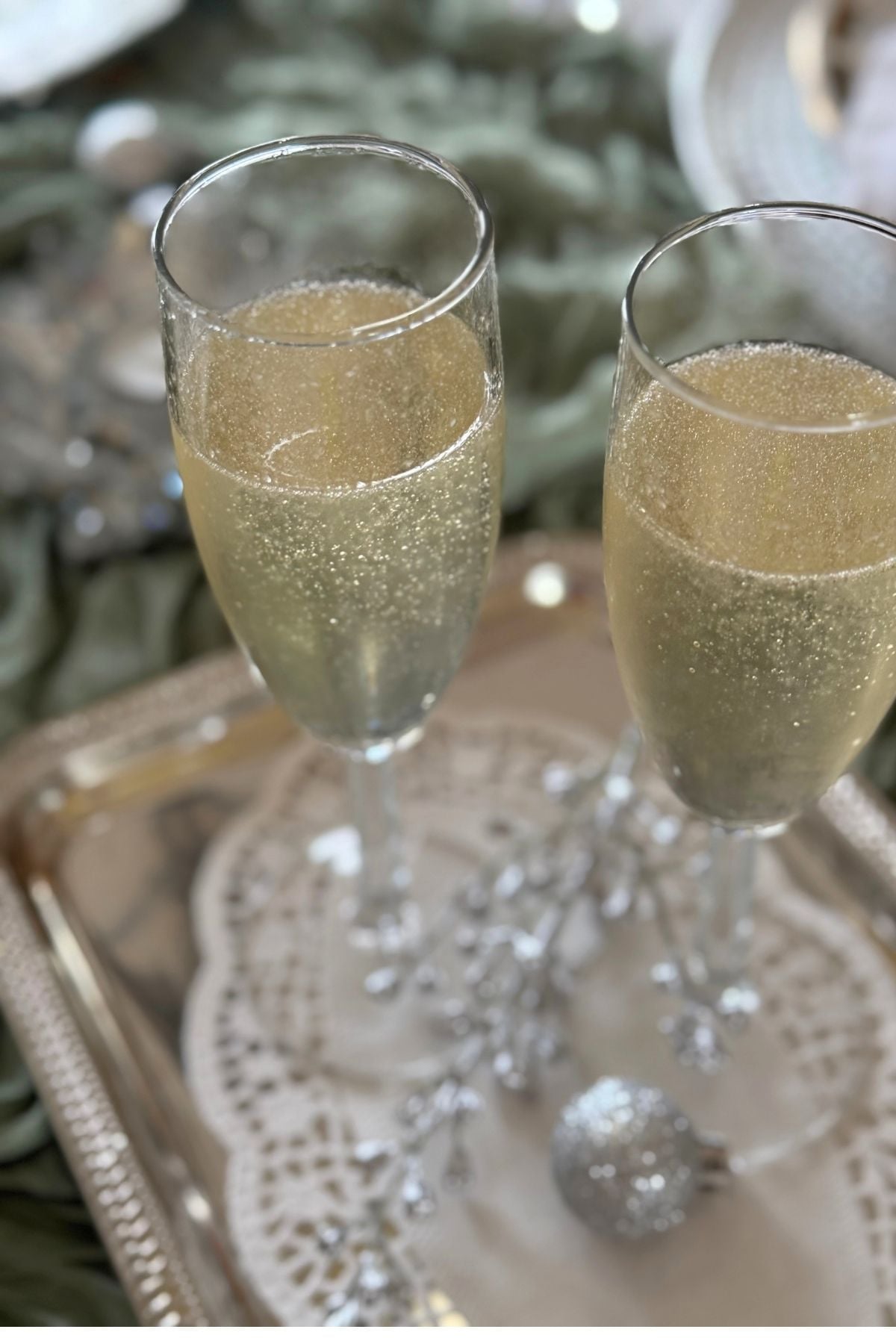 sparkling pear cocktail Sparkling Pear Cocktail served from champagne flutes on a silver tray