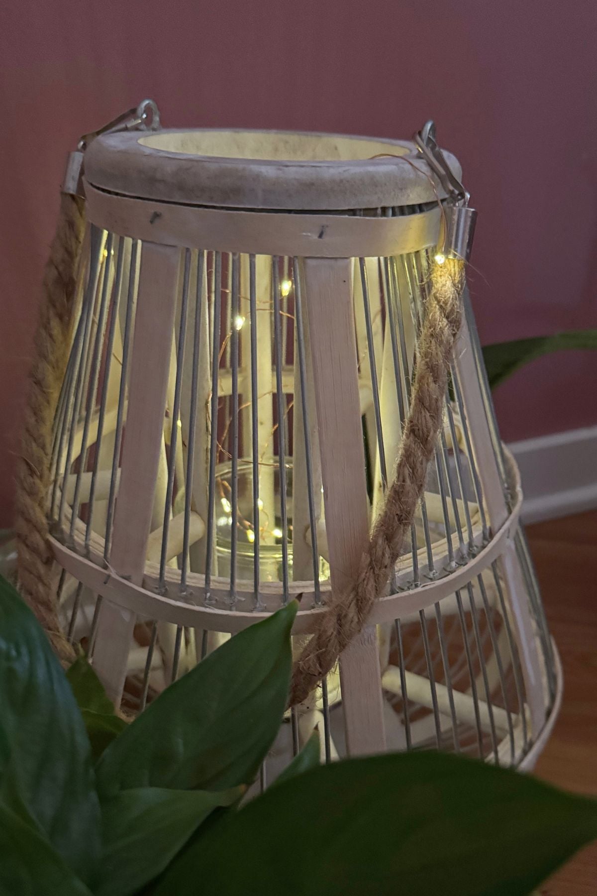 white washed basket lantern with fairy lights Whitewashed lantern filled with warm fairy lights in the Rose Parlour