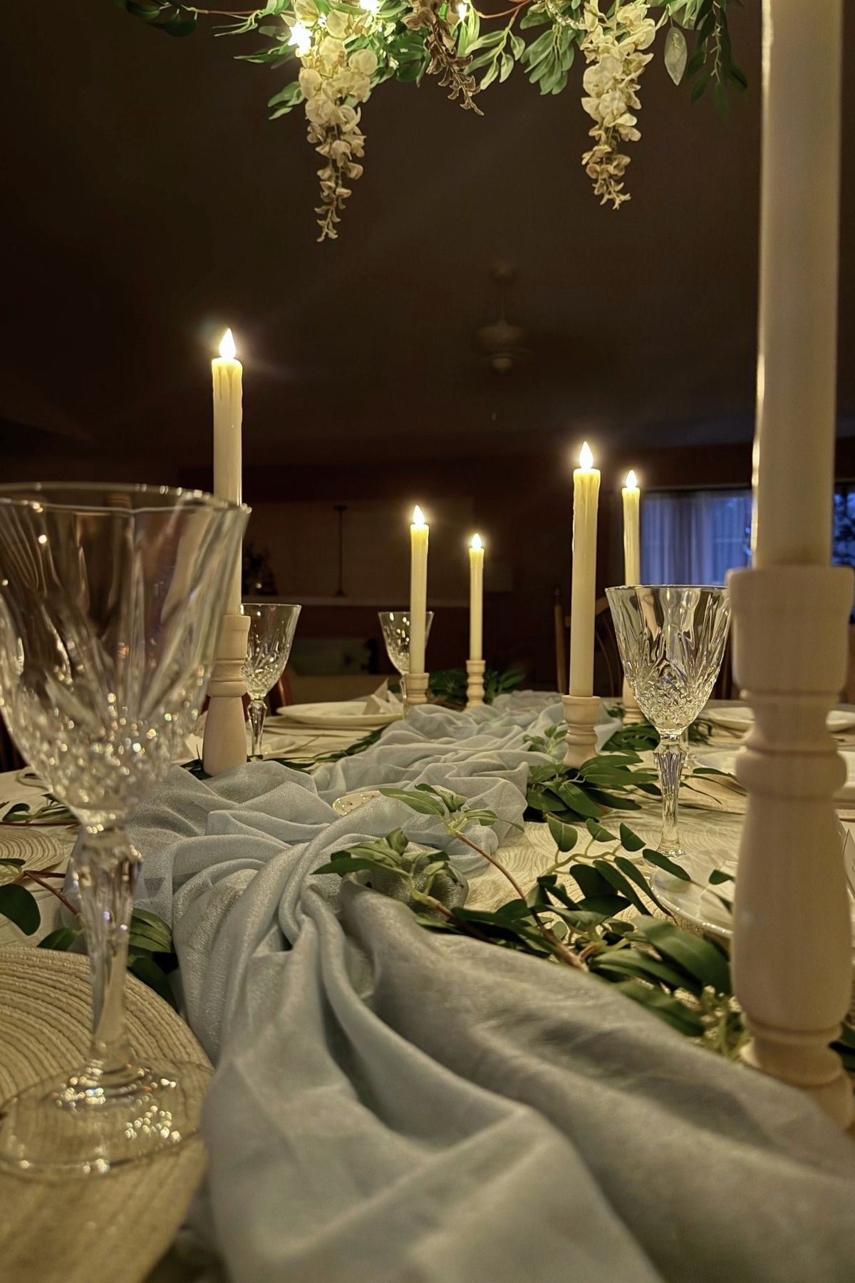 river table runner evening A chiffon river table runner on a candlelit dining table