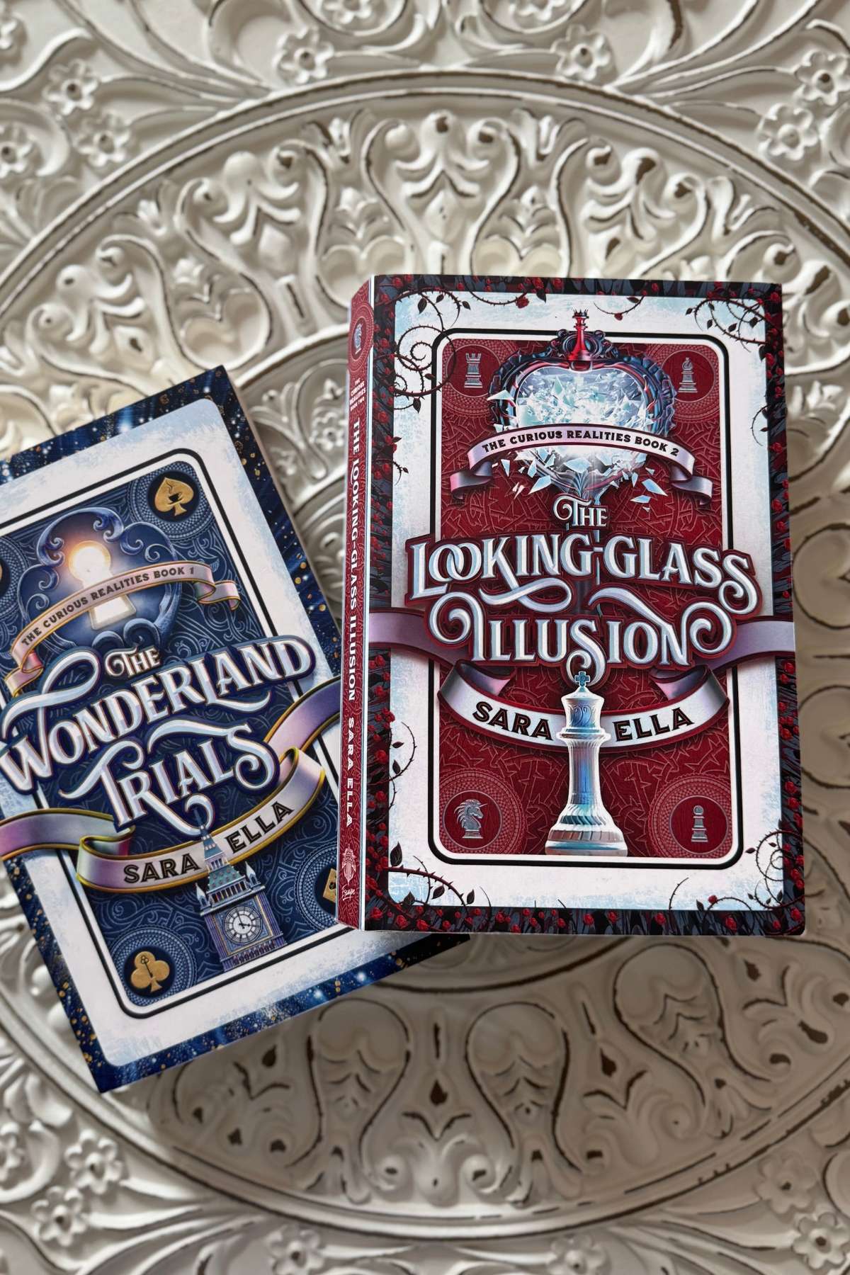 The Curious Realities Books: The Wonderland Trials and Looking Class Illusion by Sara Ella