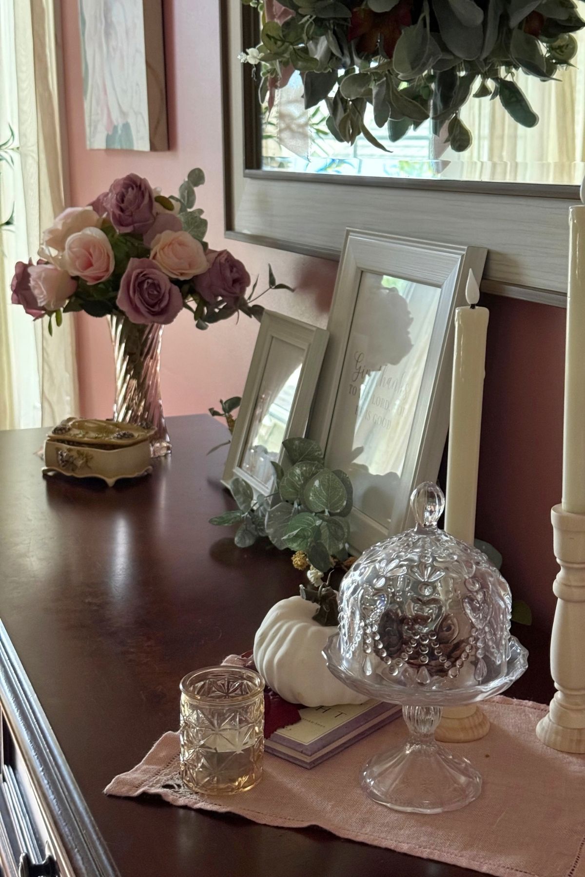 autumn sideboard decor Autumn sideboard decor featuring faded roses, glass cloche, votive candle and autumn details.