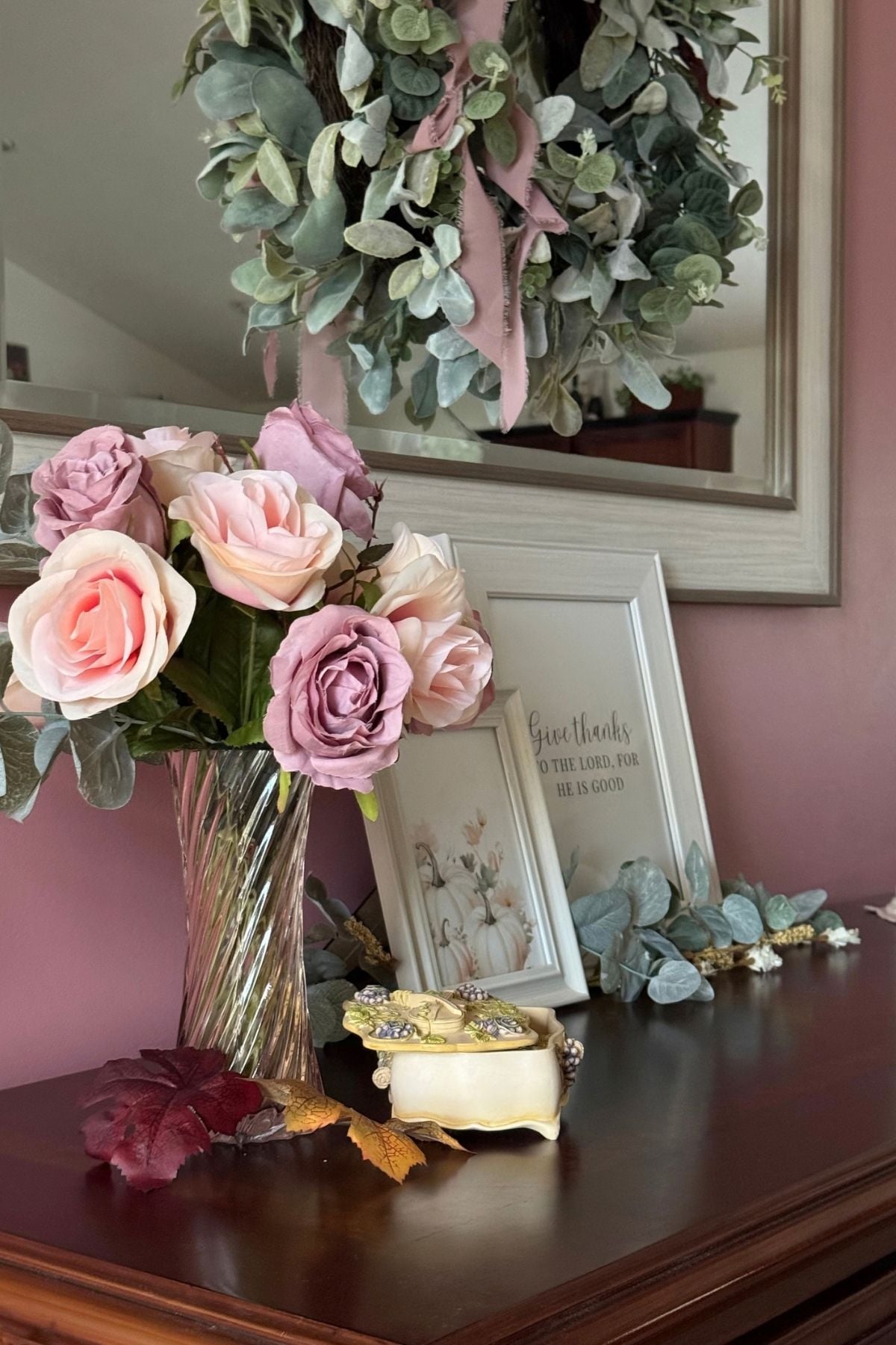 autumn sideboard styled with faded roses A living room sideboard styled for autumn with faded roses